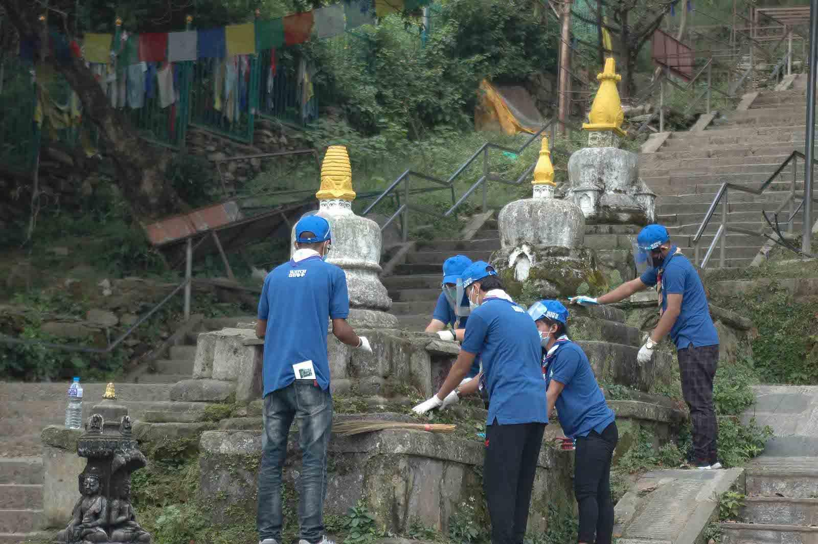 Watch Day volunteers maintaining another set of shrines at Swayambhunath temple, Nepal.